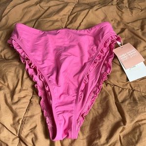 Small pink high waisted cheeky bikini bottom from Dippin Daisy’s. New with tags